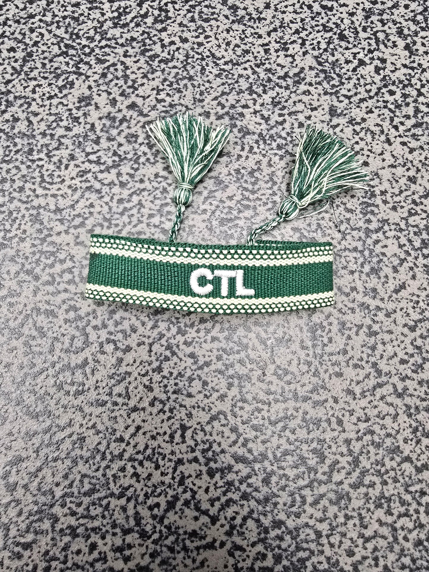 Bracelet: Embroidered with Care to Learn logo